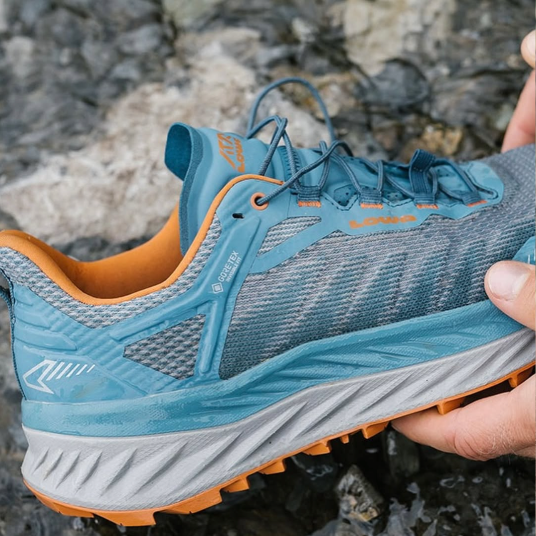 A close up photo of a blue LOWA FORTUX GTX