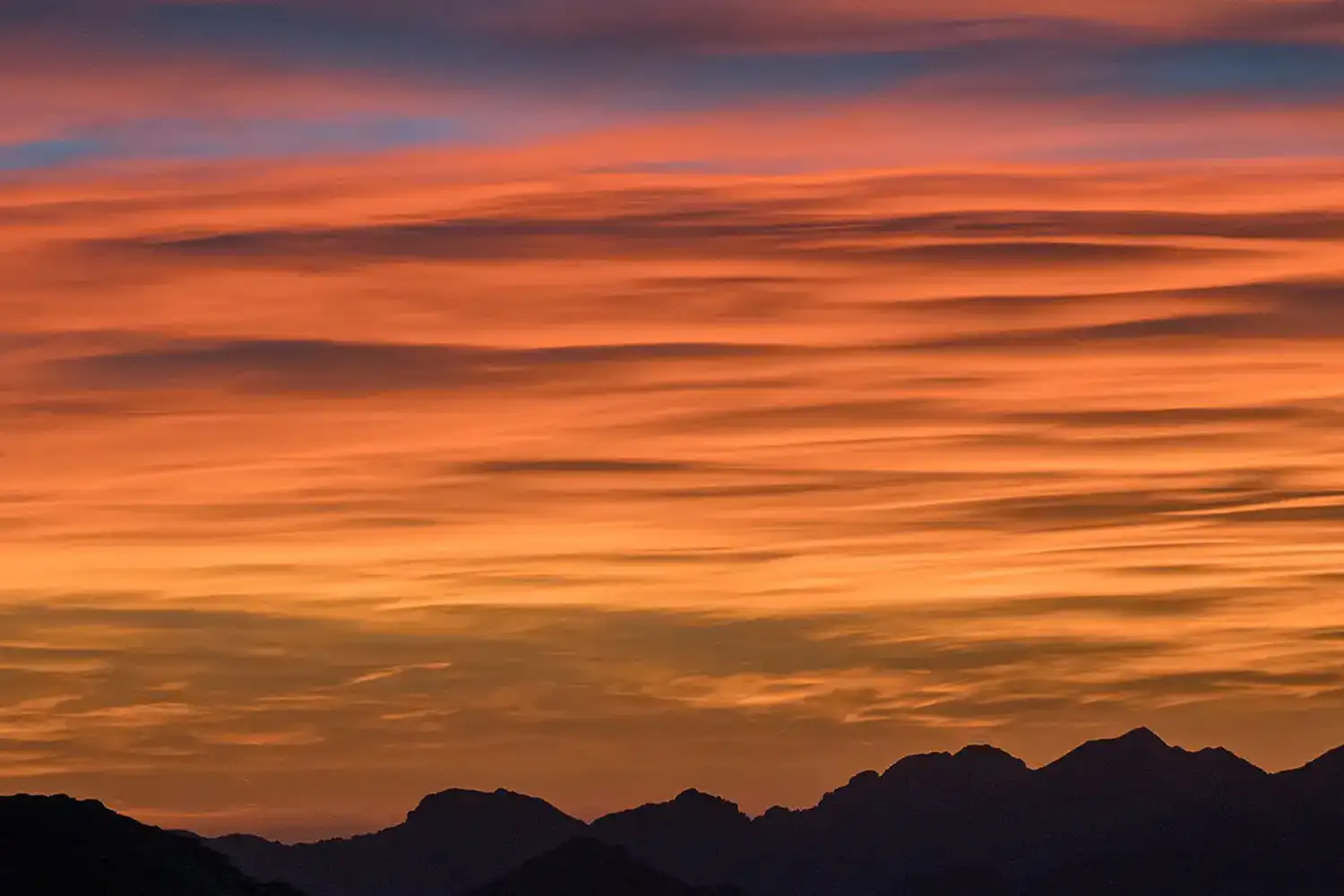 sunset sky with mountain ridgeline