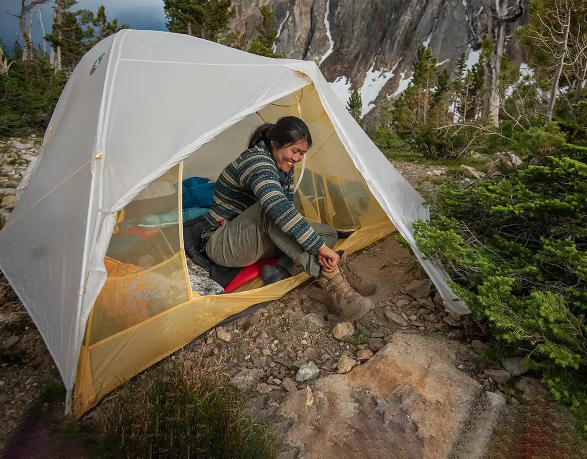 woman backpacker in tent