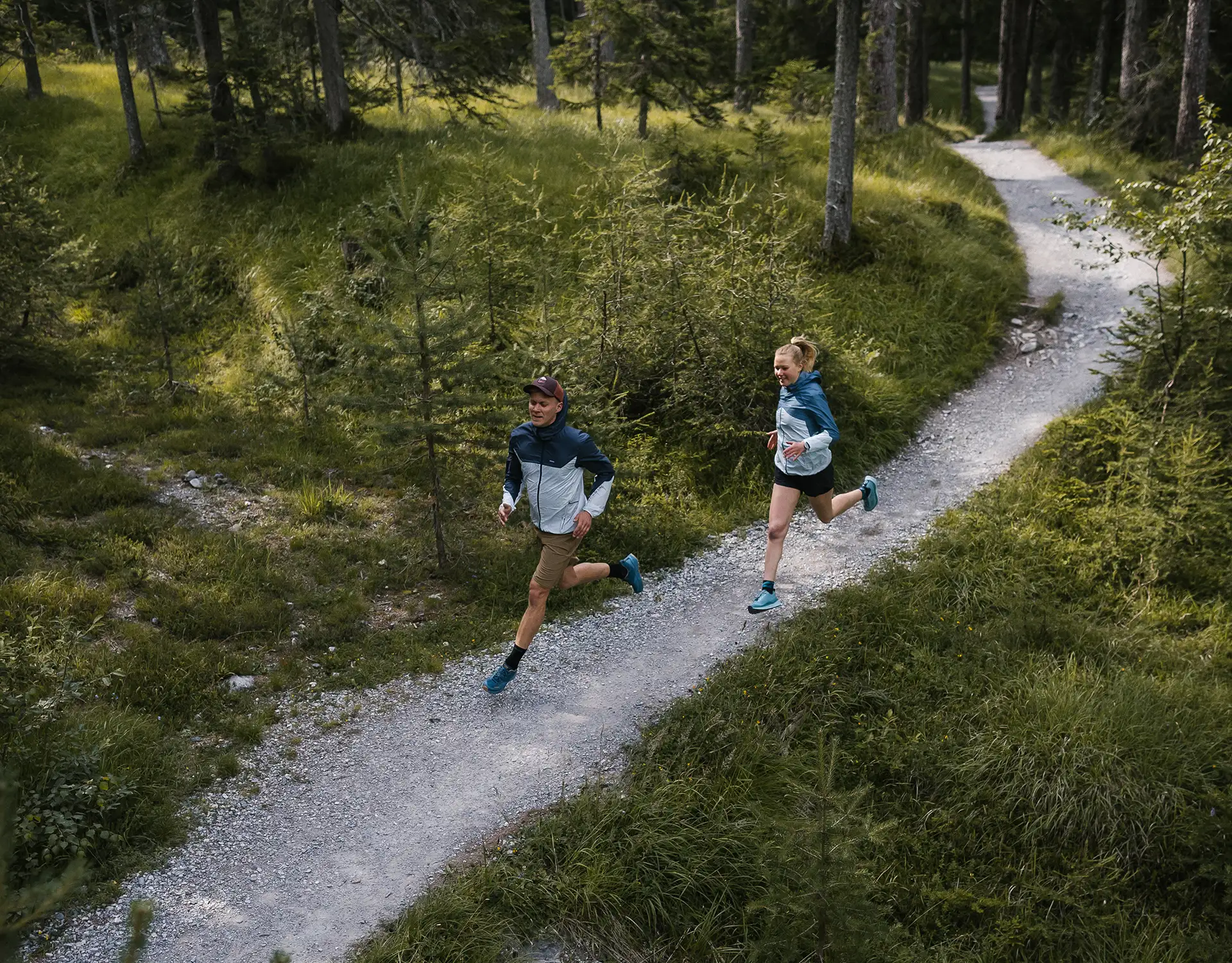 Man & woman running on trail