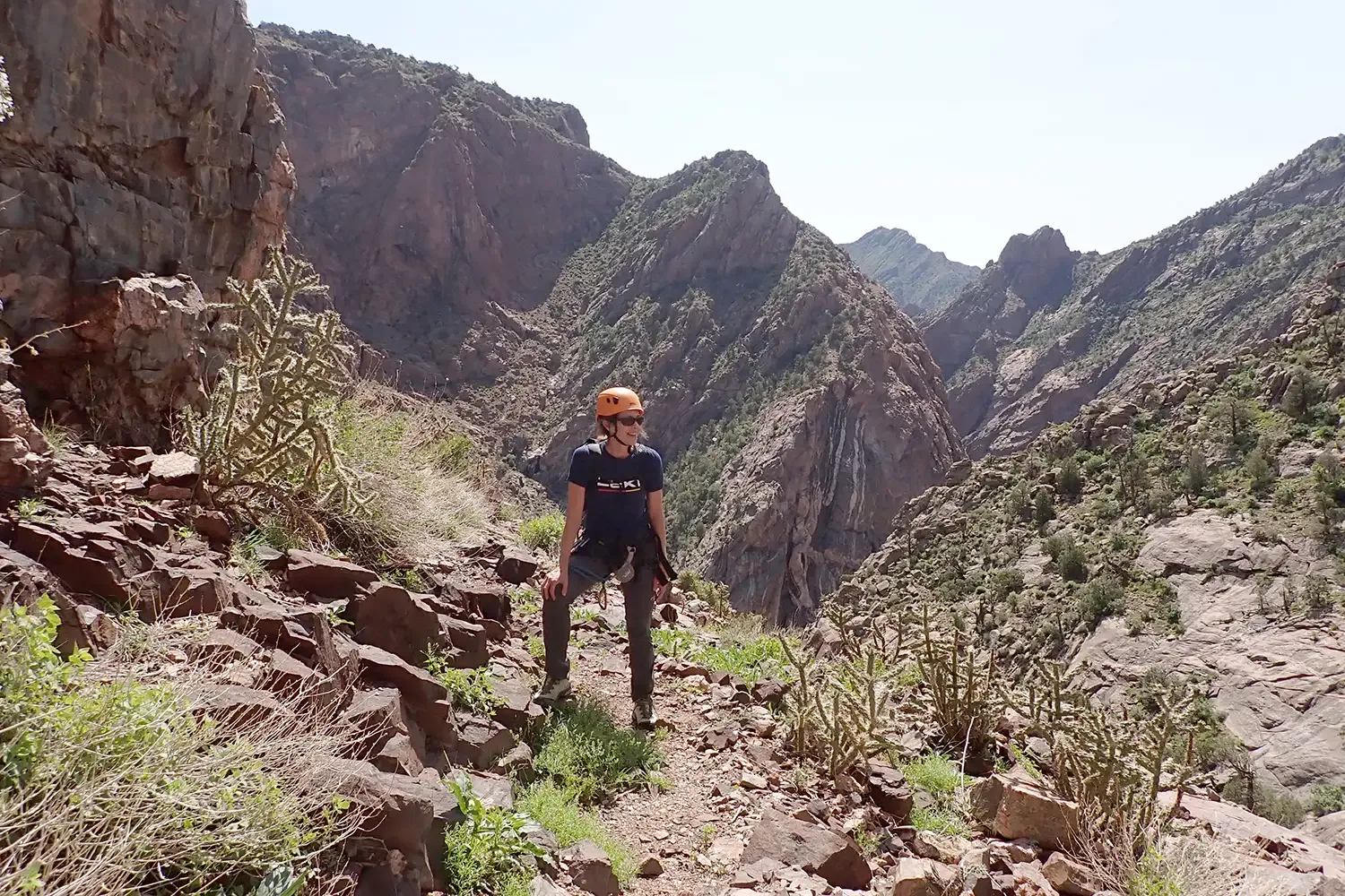Lisa on the Royal Gorge via ferrata with red rock in the background