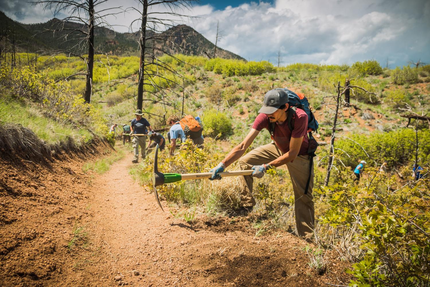 trail volunteers working on dirt trail maintenance